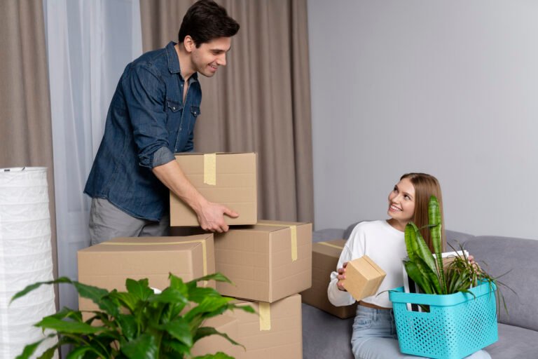 couple-handling-boxes-belongings-after-moving-new-house